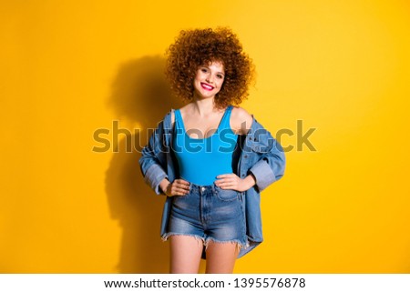 Close up photo beautiful amazing she her lady wavy fluffy styling curls hands arms sides ready party wear casual jeans denim shirt shorts blue tank top outfit clothes isolated yellow bright background
