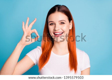 Portrait of nice attractive pretty people youth advertise agree choose decide recommend adverts sale information promo offer excited satisfied content candid dressed t-shirt isolated blue background