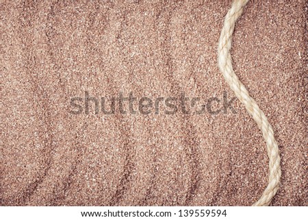 Sand texture background with rope
