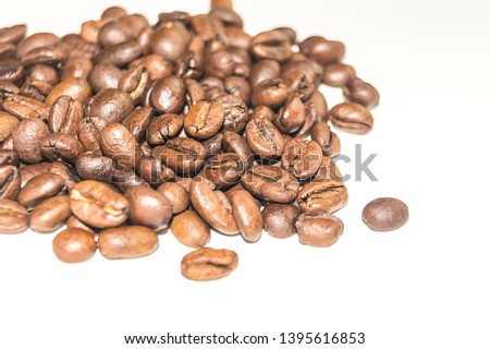 Pattern with coffee beans white background for decoration design. White isolated background. Organic ingredient. Morning coffee. Healthy breakfast. Breakfast beverage. Focus on the center.