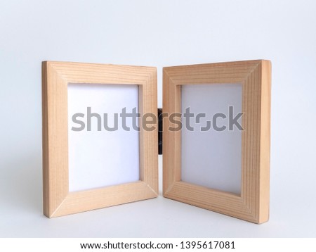 Two blank picture fame with old black hinge, Bi-fold wooden photo frame on white background with clipping path.