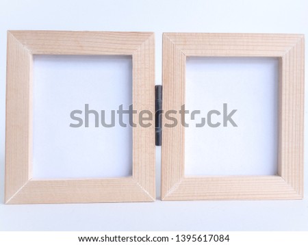 Twin blank picture fame with old hinge, Bi-fold wooden photo frame on white background with clipping path.