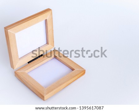 Twin blank picture fame with black hinge, Bi-fold wooden photo frame on white background with clipping path. Isomatric view from top.