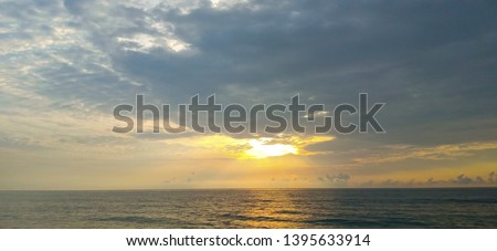 Beautiful Sunrise with Golden Sky at Sea Shore Bay of Bengal in Chinthamani near Kattupalli Jungle, Thiurvallur District, Tamil Nadu in India 
