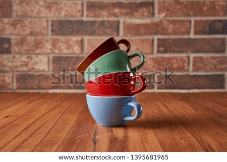 Color coffee cups composition with background    