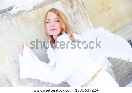 woman with white wings, snow christmas angel