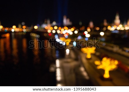Abstract city lights background. Defocused urban background at night. Bokeh multicolored