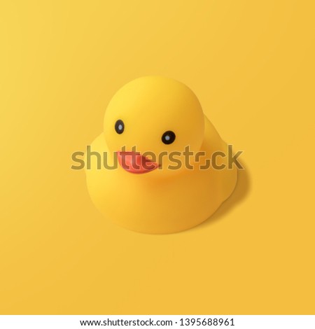 Yellow rubber duck on yellow background Modern style. creative photography.