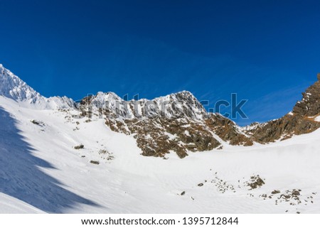winter landscape with the mountain peaks covered by heavy snow. aerial view by drone. romanian mountains, Negoiu peak, Fagaras Mountains