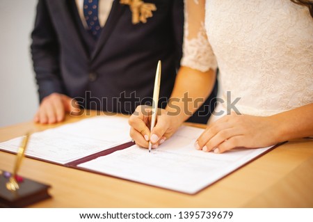 Photo of a wife and husband at civil registration, ceremony day Royalty-Free Stock Photo #1395739679