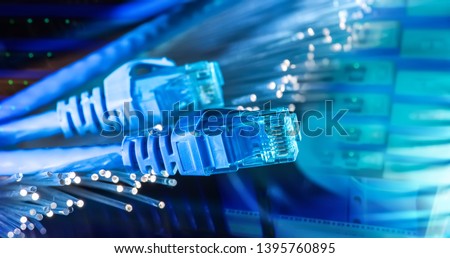 network cables with fiber optical background Royalty-Free Stock Photo #1395760895