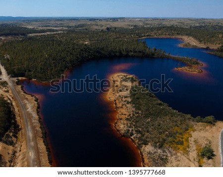 Aerial view from a pond with contaminated waters of an old mine