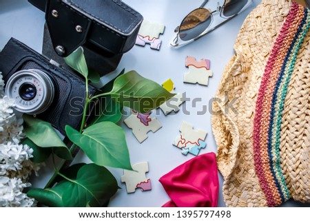 Summer holidays and summer vacation planning. We are going to rest and plan a vacation. Beach resorts. Straw hat. Sunglasses. Map