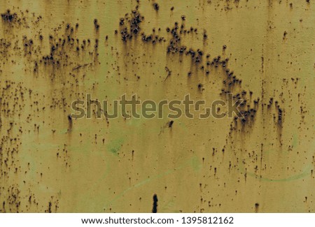 Rusty brown iron texture, green old fence with stains and peeling paint. Textured wallpaper for design.