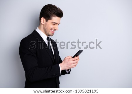 Profile side view photo of smart confident executive investor investment concept have success new contract get messages feel satisfied isolated wear trendy fashionable clothing on grey background