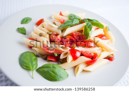 Typical Italian pasta with fresh tomatoes and basil
