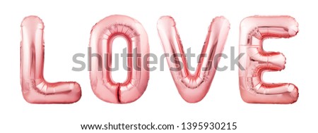 Word LOVE made of rose gold inflatable balloon letters isolated on white background