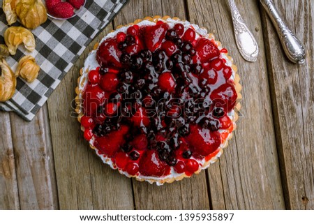 berry pie on wooden background