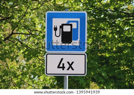 road sign elektric gas station Royalty-Free Stock Photo #1395941939