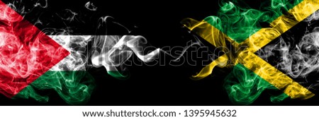 Palestine vs Jamaica, Jamaican smoky mystic flags placed side by side. Thick colored silky smokes flag of Palestinians and Jamaica, Jamaican.