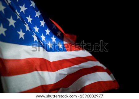 American flag on black background.