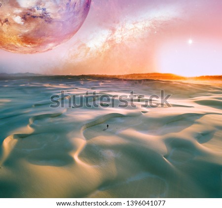 Alien landscape of sunrise over pristine sand dunes with lonely person walking. Elements of this image furnished by NASA