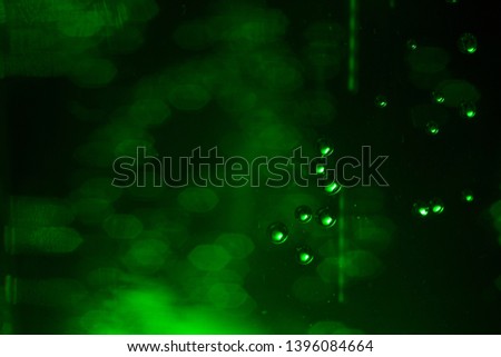 Green Champagne,Effervescent drink. Underwater fizzing air bubbles texture background