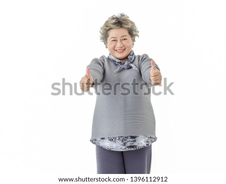Happy Asian senior woman  make thumbs to admire, isolated on white background