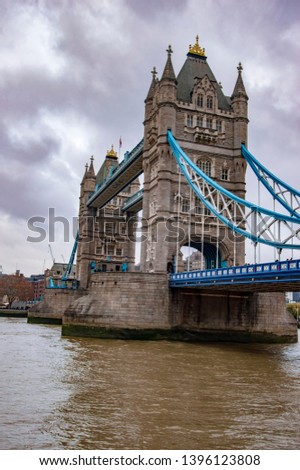 The tall tower bridge london with gusty winds and clouds