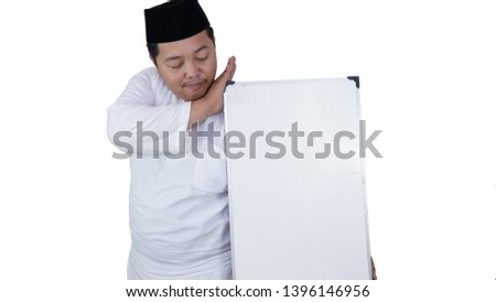 smiling muslim asian with overweight standing and holding white board presenting coppy space.