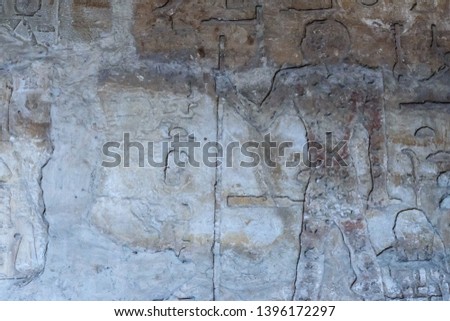 Egyptian ancient pictures on a stone wall