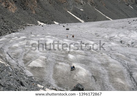 Glacier in the Altai mountains. Climbing people