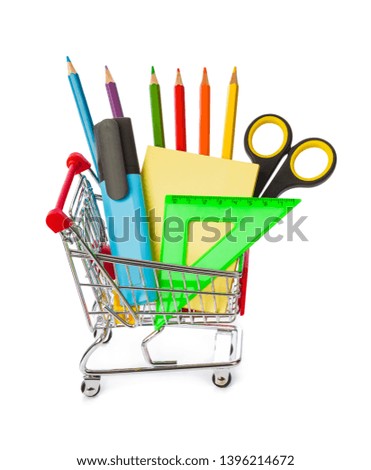 Stationery in shopping cart isolated on white background