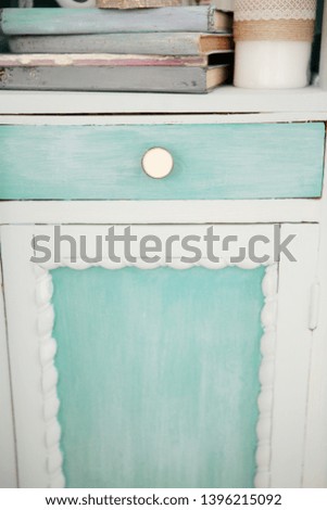 Beautiful home interior. Rustic style turquoise  cupboard