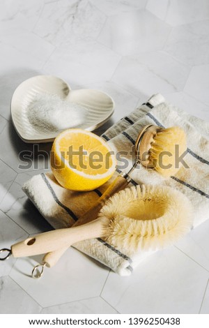 Natural cleaning products lemon and baking soda with bamboo dish brushs. Eco friendly. Zero waste concept. Plastic free.