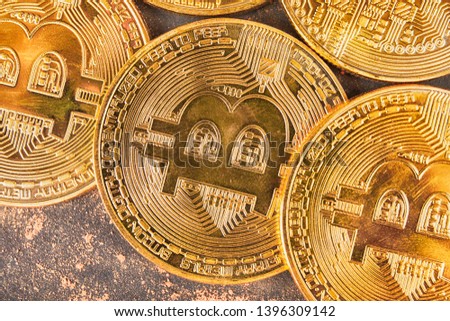 Gold bitcoin on black background. Crypto-currency concept