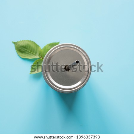 Top view of a reusable jar with a metal lid and a straw for hot and cold drinks. Reusable application. Individual use. Save the planet. Concept zero waste.