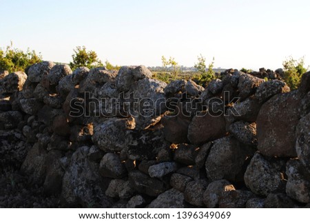 
stones on the border of the territory between the lands in Syria. Spring Royalty-Free Stock Photo #1396349069