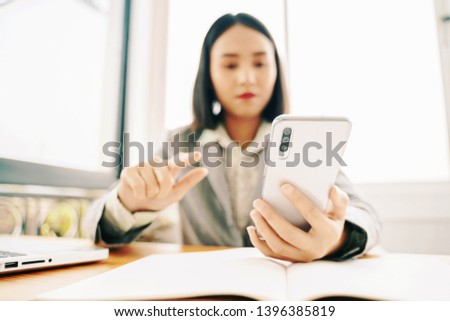 women using smartphone or digital tablets chatting while having coffee in  cafe. for checking pictures and SMS ,hipster girl watching video on mobile phone during breakfast
