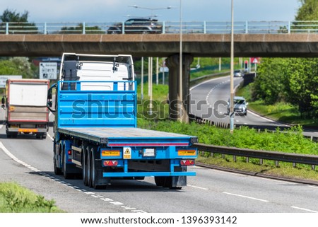 flatbed lorry truck on uk motorway in fast motion