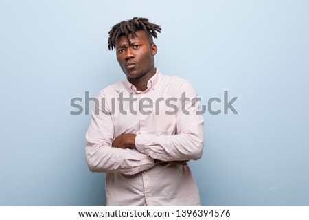 Young business african black man unhappy looking in camera with sarcastic expression.