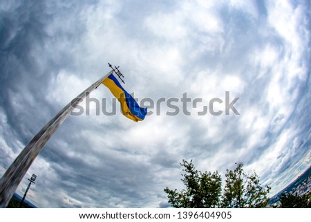 Flag of Ukraine against the sky.