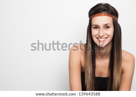 Young brunette woman posing with brown leather haed-band