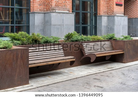 wooden bench on the sidewalk