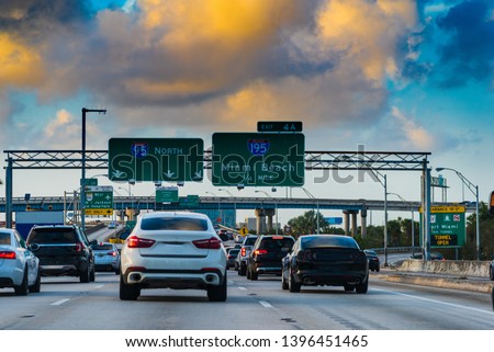 Dark clouds over Interstate 95 at sunset in Miami, USA