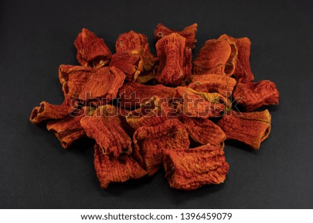 Bunch of Sun Dried Bell Peppers on Black Background