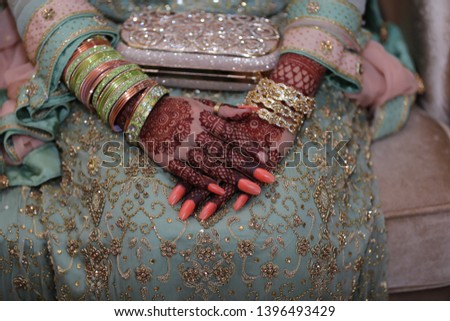 Bride hands with mehndi hina on wedding day. Beautiful hands with beautiful hina design. Indian Bride hands. Beautiful bride hands picture.