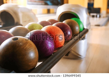 Stand with balls in bowling club