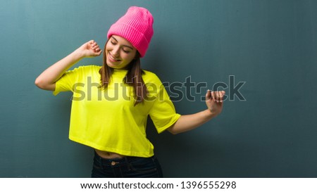Young modern woman dancing and having fun