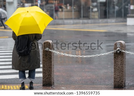 People with umbrella in rainy day in rain season.